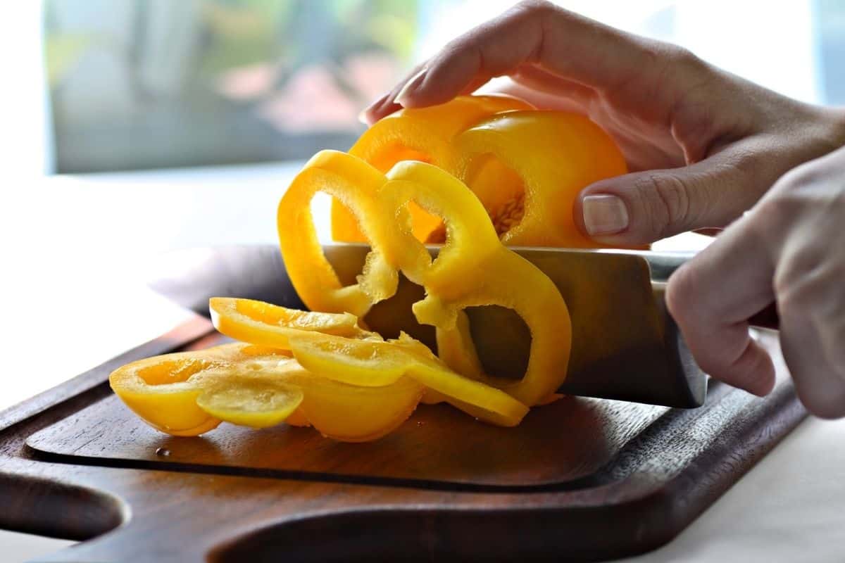 Yellow bell pepper being sliced