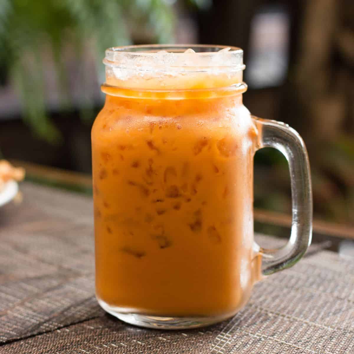 a glass mug of Thai iced tea