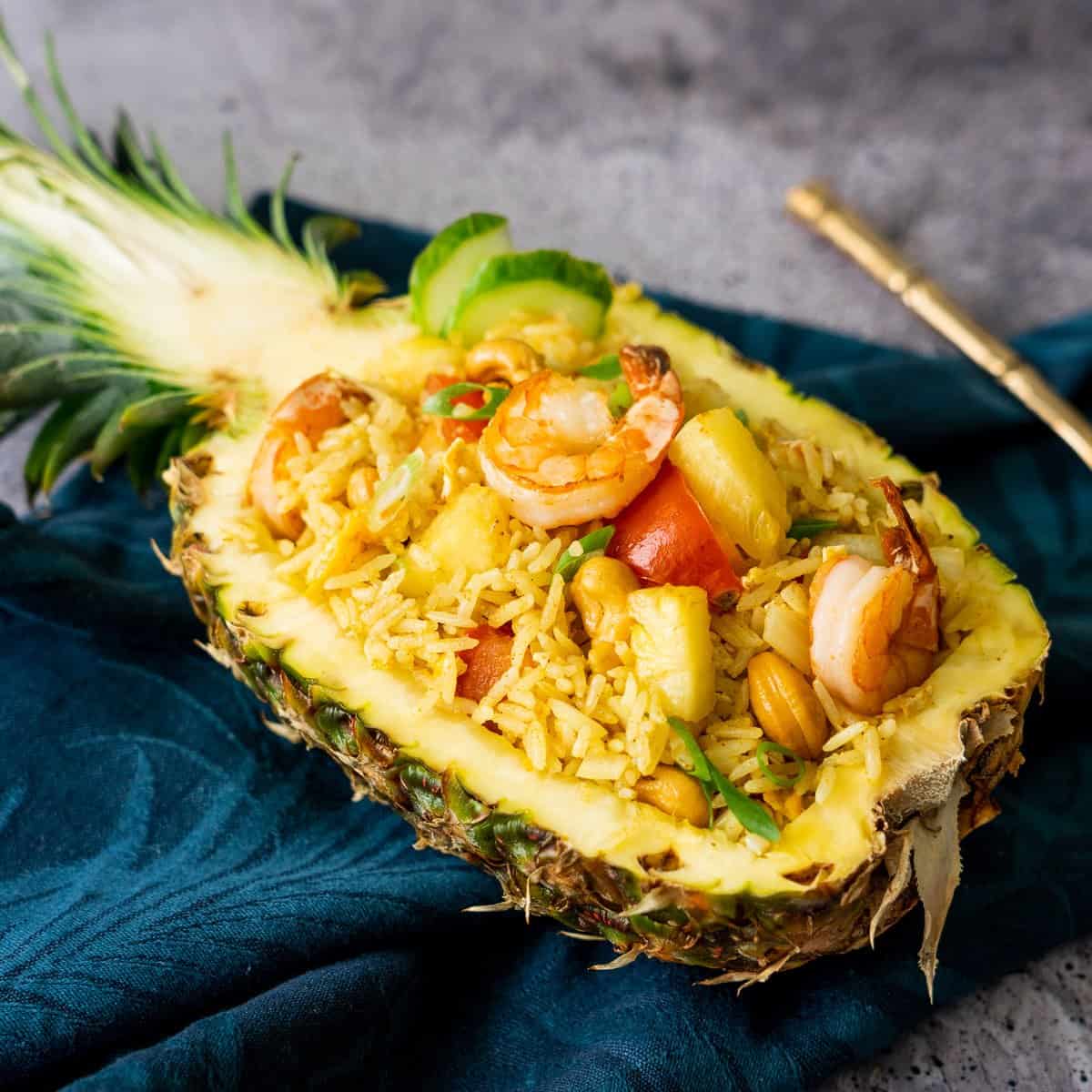 pineapple fried rice in a pineapple bowl