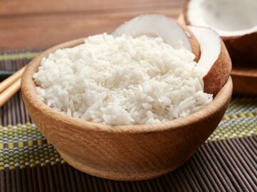 a bowl of coconut rice with coconut garnish