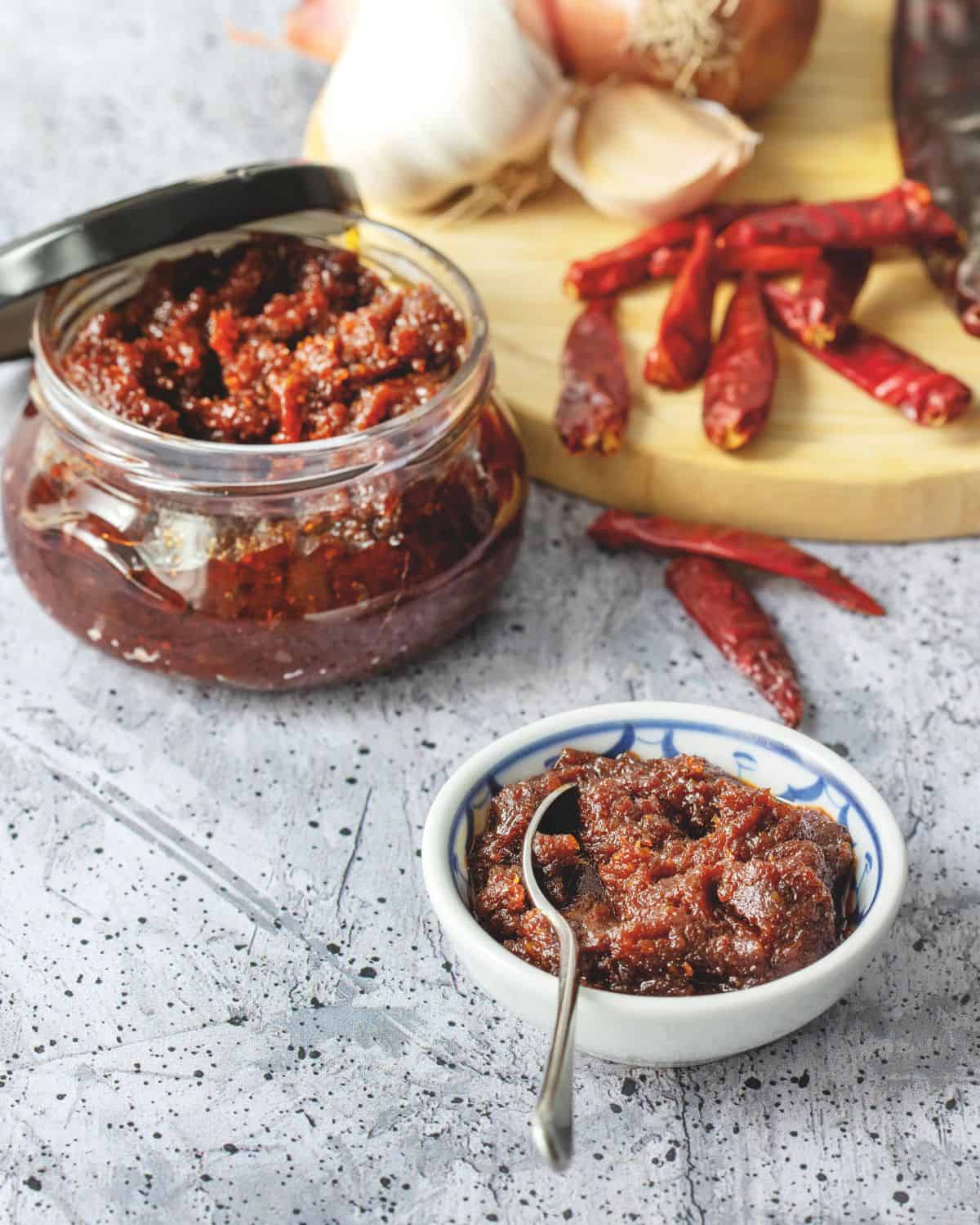 Thai chili paste in a bowl and in a glass jar.