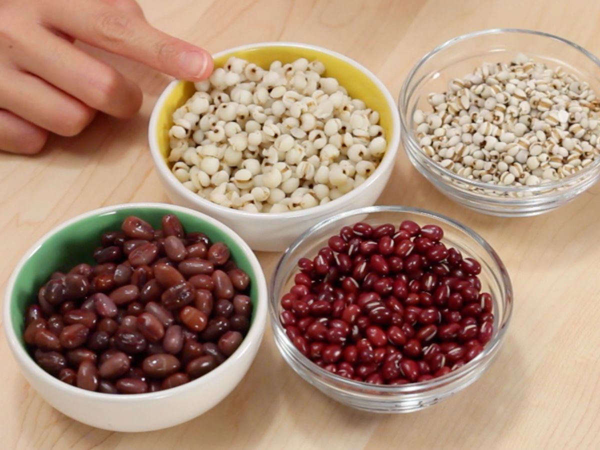 bowls of raw and cooked red beans, and raw and cooked job's tears