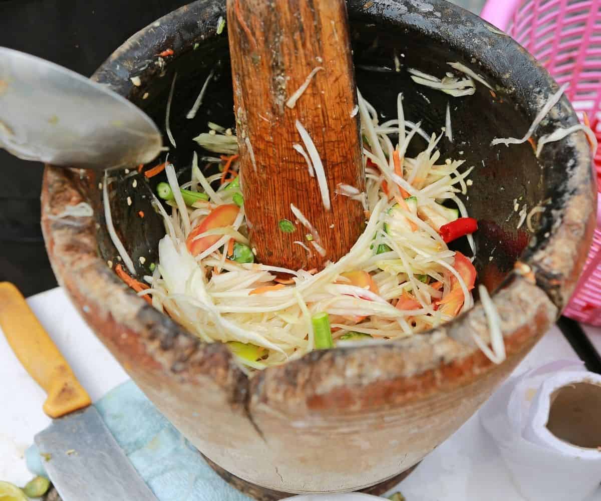 papaya salad in mortar and pestle