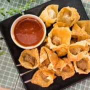 This Thai fried pork wonton recipe is a perfect make ahead appetizer: wrap them, fridge them, and fry when ready to eat! #wontons #pork #appetizer #fried #crispy #partyfood