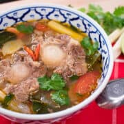 This easy Thai oxtail soup recipe is healthy and so comforting! The perfect winter or fall dish, and the ultimate comfort food. You can cook it stove top, or use your crockpot or instant pot to make it a bit easier for you! #oxtailsoup #lowcarb #paleo #glutenfree #thaifood #comfortfood