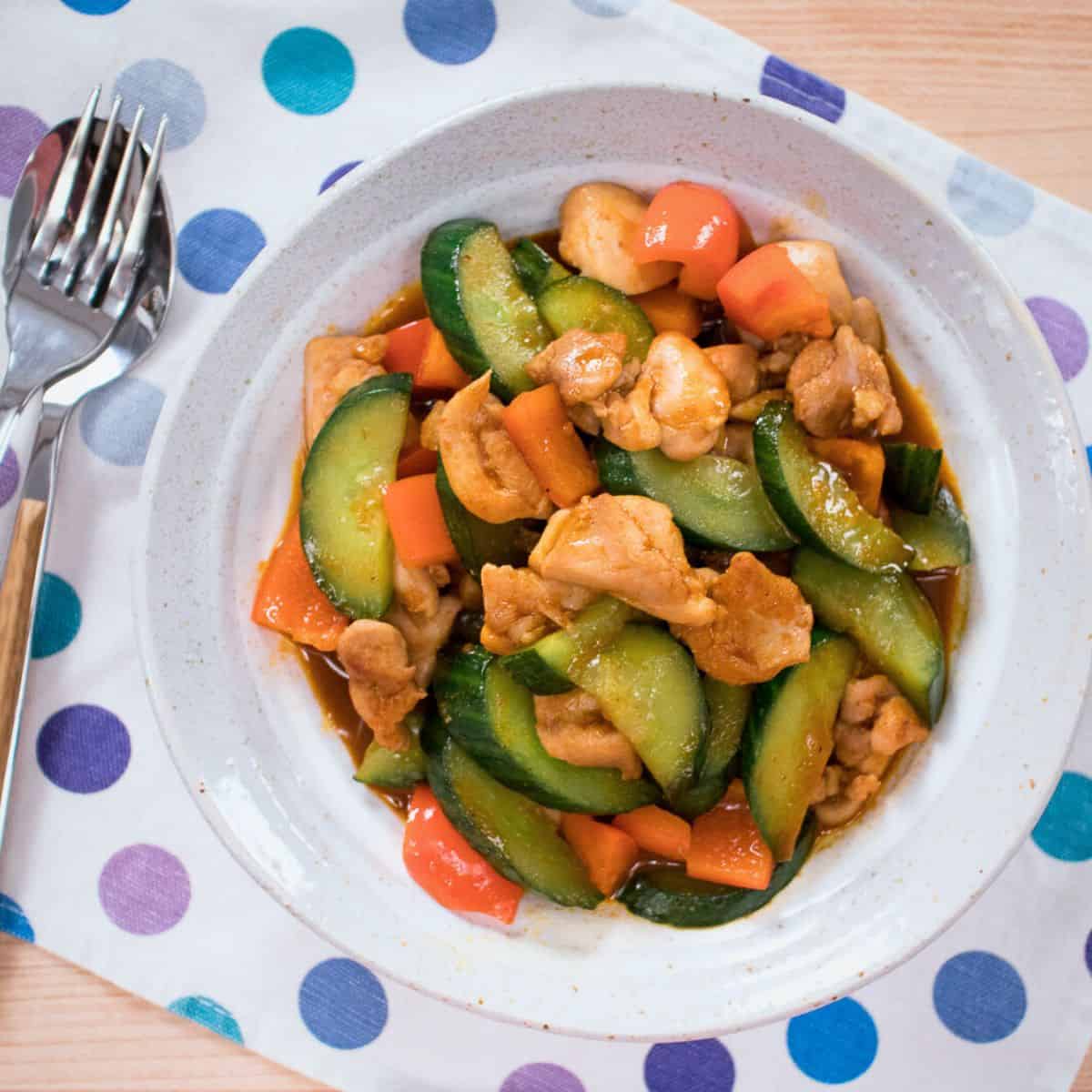 A plate of cucumber stir  fry with chicken