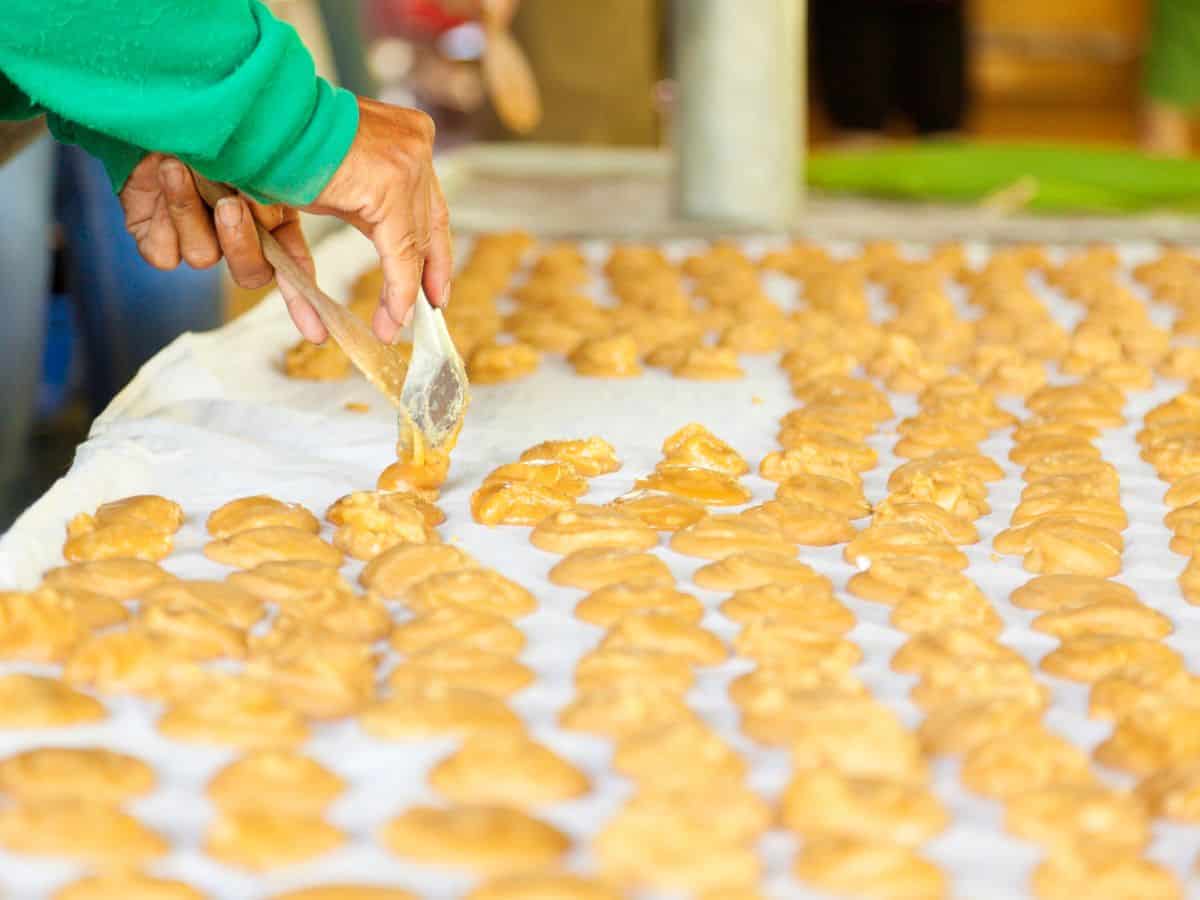 palm sugar being put into molds