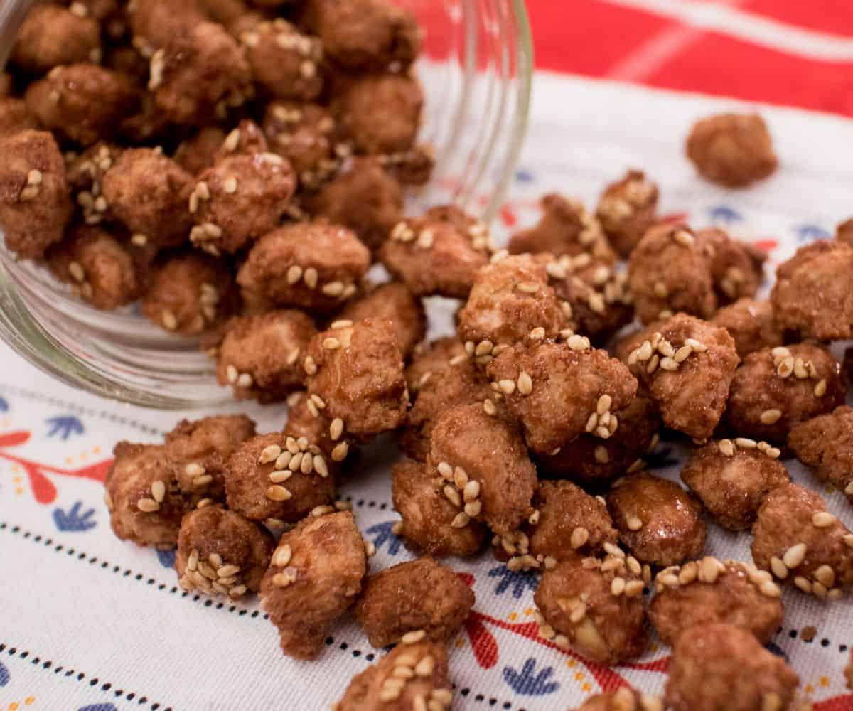 candied peanuts pouring out of a jar