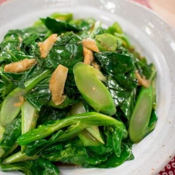 A plate of chinese broccoli stir fried with garlic