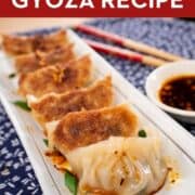 A pinterest image of gyoza with text saying "Best Juicy Gyoza Recipe"