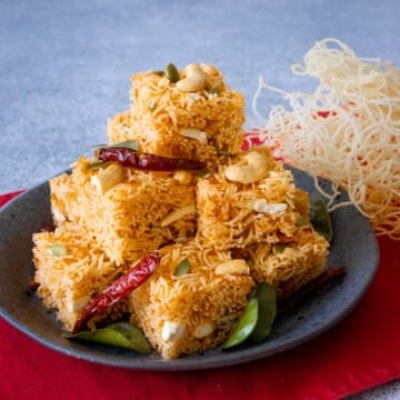 A plate of a stack of sweet and sour crispy noodle treats