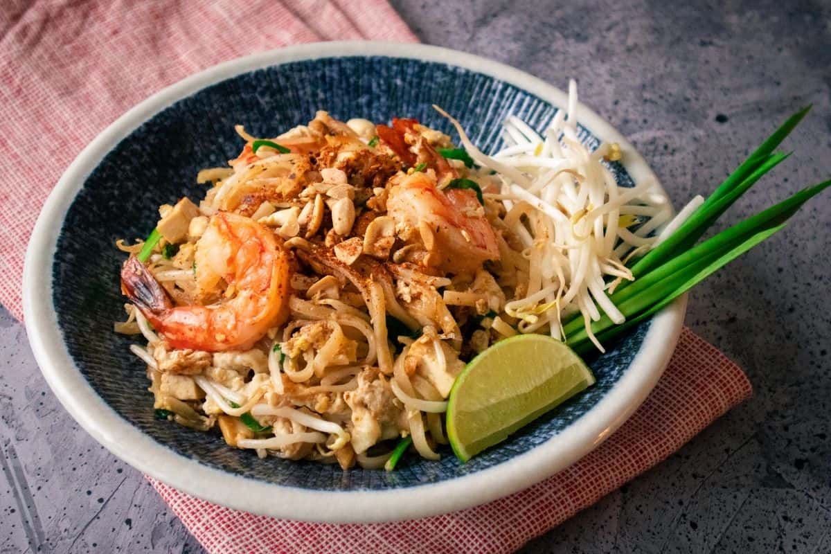 A plate of pad thai with shrimp