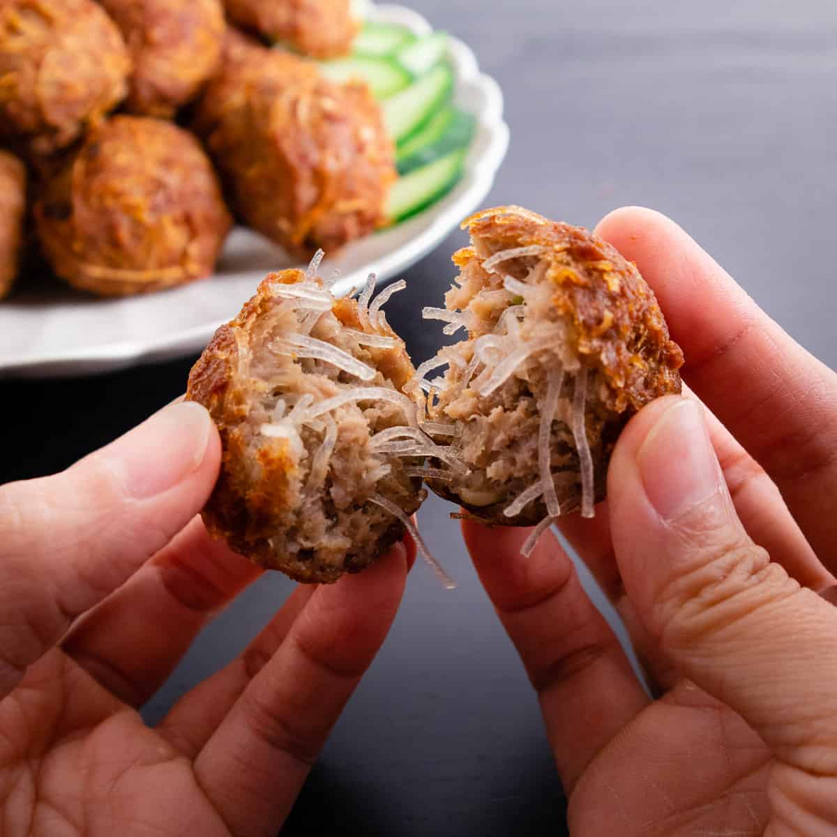 Noodle meatball torn open in half