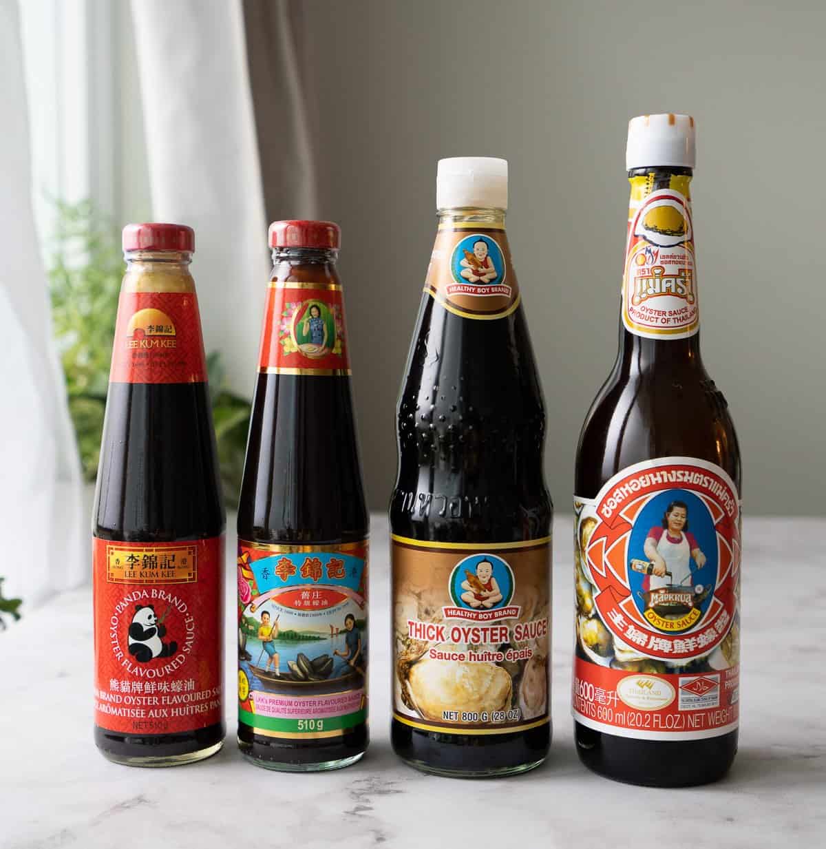 four bottles of oyster sauce