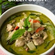 a blow of green curry chicken with text overlay "authentic thai green curry".