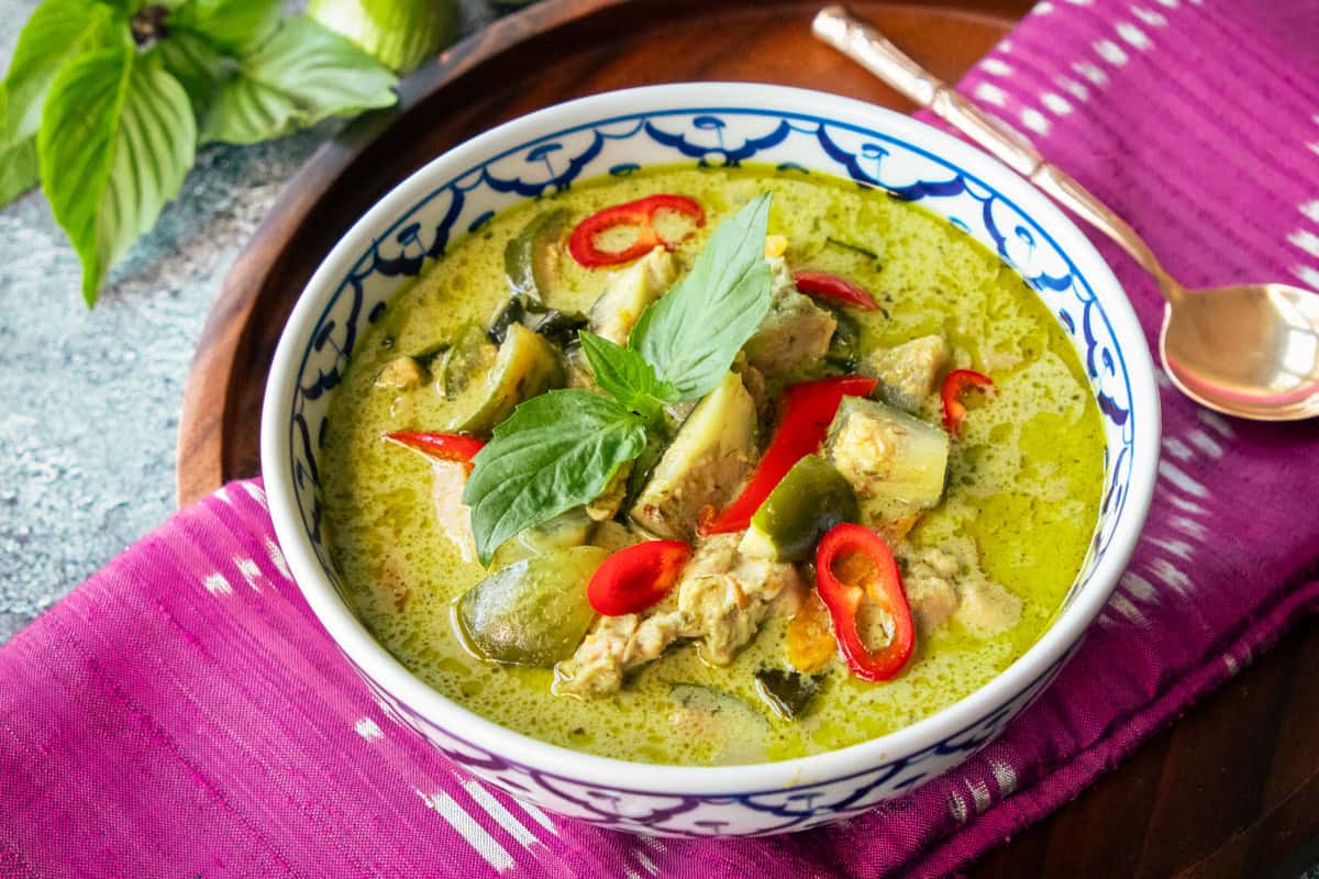 a bowl of green curry chicken