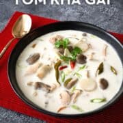 A bowl of tom kha gai soup with text overlay "authentic thai tom kha gai" and "hotthaikitchen.com"