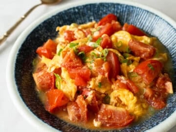 a plate of tomato and egg stir fry