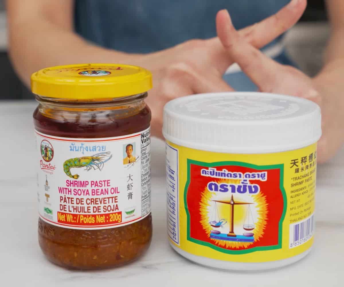 A jar of fermented shrimp paste and a jar of shrimp paste in oil