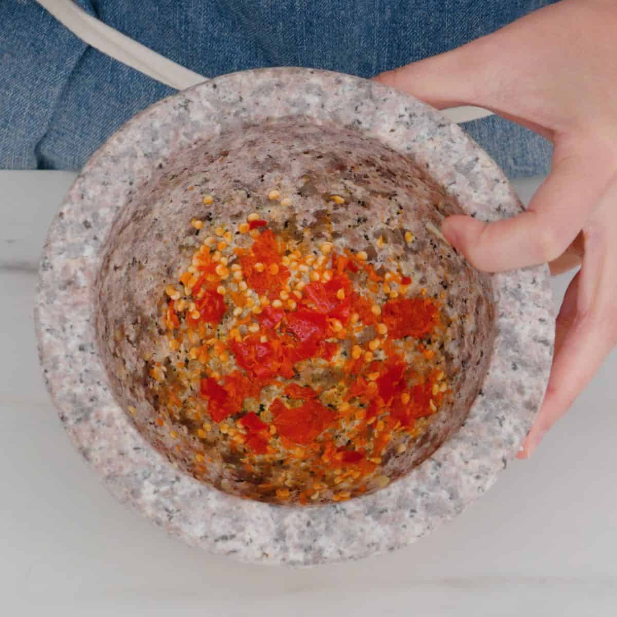 pounded chilies in mortar and pestle