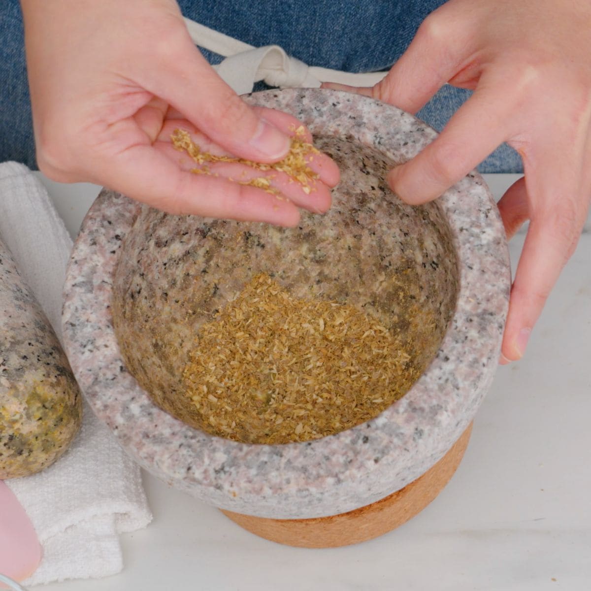 pounded coriander seeds in mortar and pestle