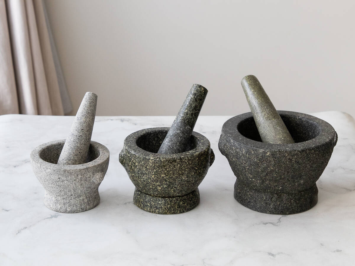 3 sets of mortar and pestle in a row, smallest to largest