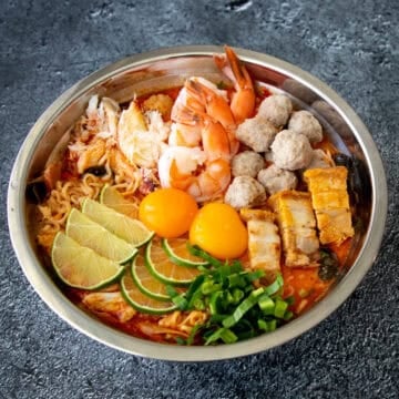 a bowl of mama jeh O with various toppings.