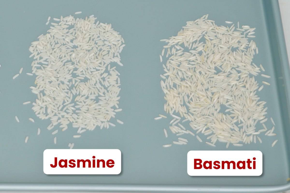 raw jasmine rice on a blue tray beside raw basmati rice