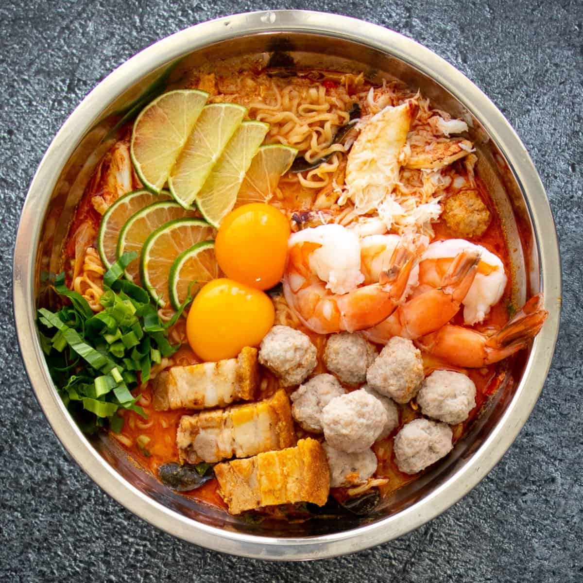 a bowl of mama jeh O tom yum noodles