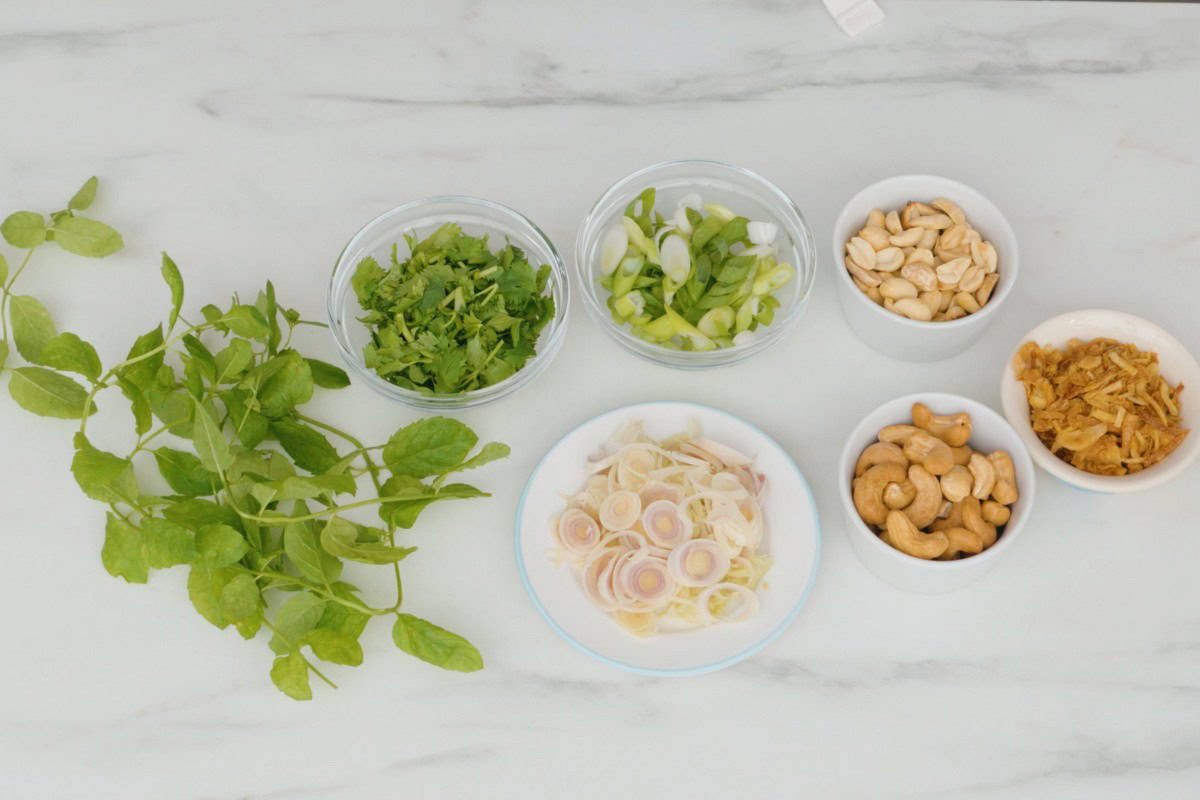 Herbs and topping options for thai salads