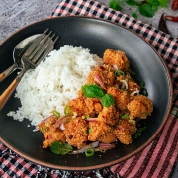 a bowl of spicy chicken rice bowl
